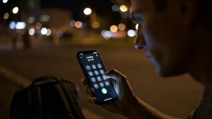 Someone is calling 2-1-1 on a cell phone for emergency housing assistance.
