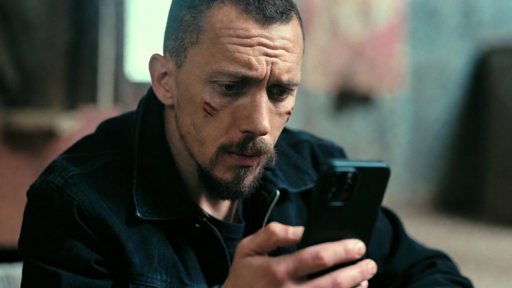 Warning sign regarding fake government grant scams asking for upfront fees.