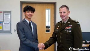 An Army ROTC scholarship candidate shaking hands with a Professor of Military Science during their university interview.
