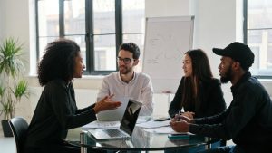 Multicultural startup team discussing business strategy and funding options