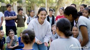 College student volunteering in the community, demonstrating the leadership DNA required for philanthropic endowments.