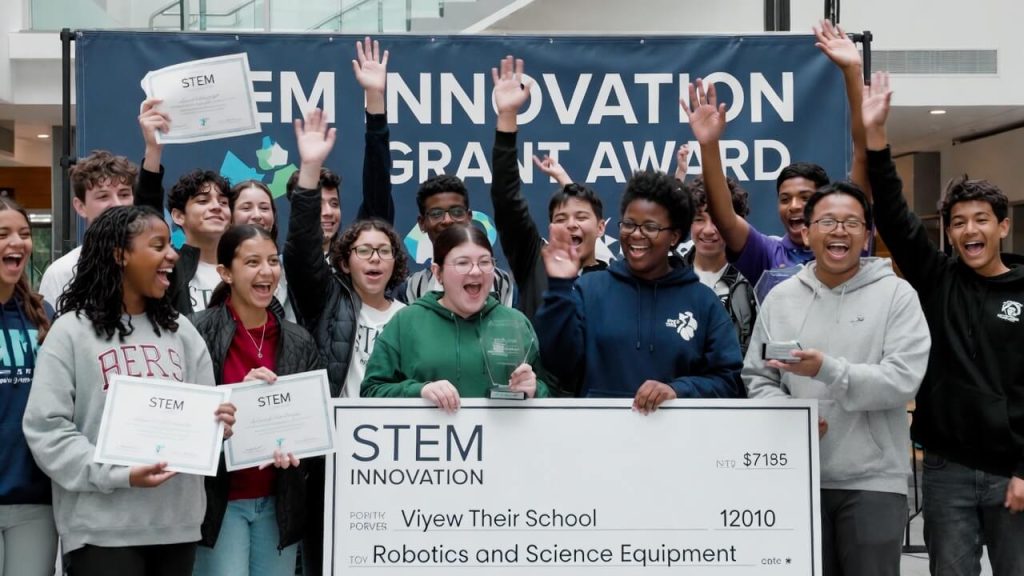 Students winning a STEM innovation grant for robotics and science equipment.