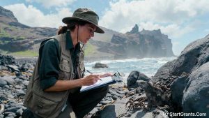 A high school science teacher examining marine life during a grant-funded summer professional development fellowship in the Galapagos Islands.
