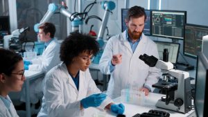 Diverse scientists working in a high-tech lab funded by SBIR government grants.
