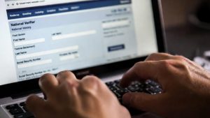 Filling out the free government laptops application form on the official National Verifier website.