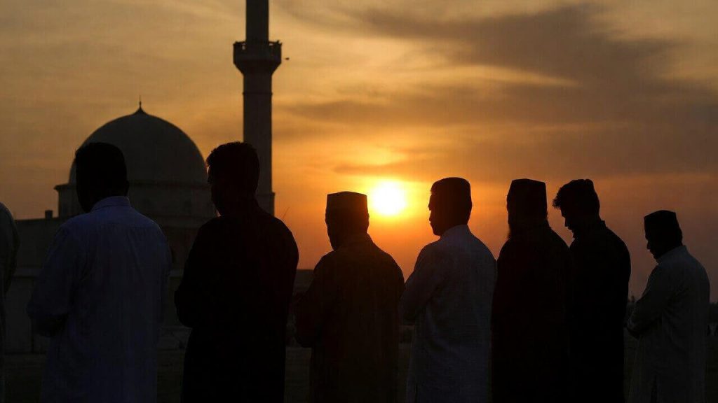 The Muslim community gathering for a Janazah prayer representing the Fard Kifayah obligation to help with burial costs