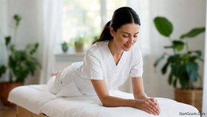 A professional massage therapy student practicing in a serene, bright training room