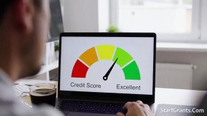 A person checking their credit score on a laptop to qualify for a housing grant.