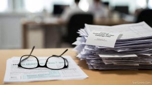 A taxpayer reviewing an IRS Form 1040 and wondering are donations to political campaigns tax deductible before filing their tax return.
