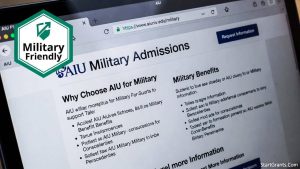 The American InterContinental University (AIU) logo displayed on a tablet screen showing military grant benefits.
