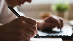 Writing a personal hardship letter to apply for a free computer from a charity.