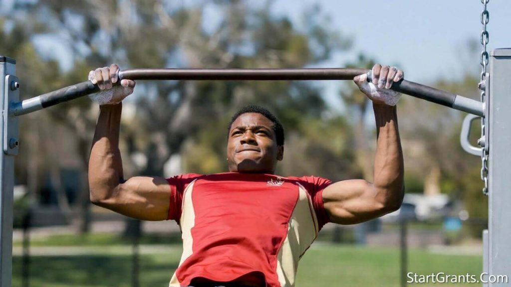 A Marine Corps ROTC scholarship applicant training for the Pull-up portion of the Physical Fitness Test (PFT).
