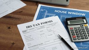 IRS tax forms and a calculator demonstrating the Section 25C energy efficient home improvement credit for windows.