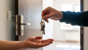 Handover of Section 8 apartment keys or permanent housing to a new tenant.