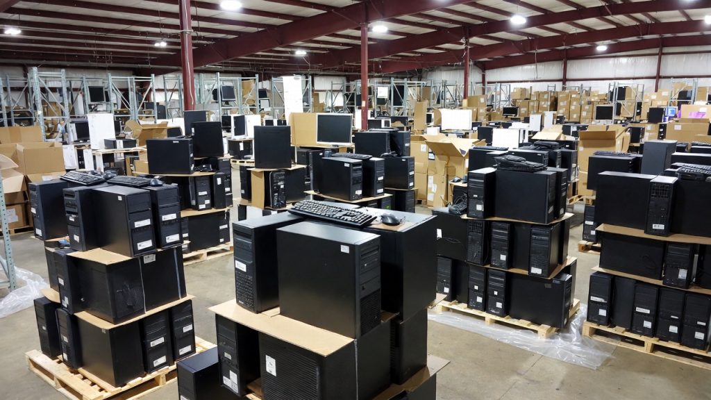 Warehouse full of surplus government computers ready for donation to schools.
