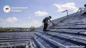 A contractor installing energy-efficient upgrades funded by government home repair grants.