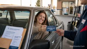 A low-income mother using a free prepaid gas card from a community charity at a gas station.